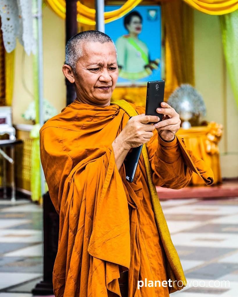 Buddhist monk takes a selfie at Wat Phra That Doi Suthep