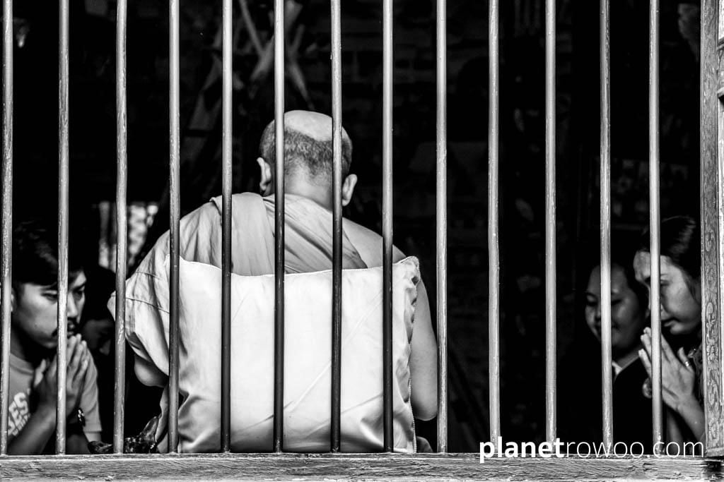 Buddhist monk giving a blessing at Wat Chai Mongkhon