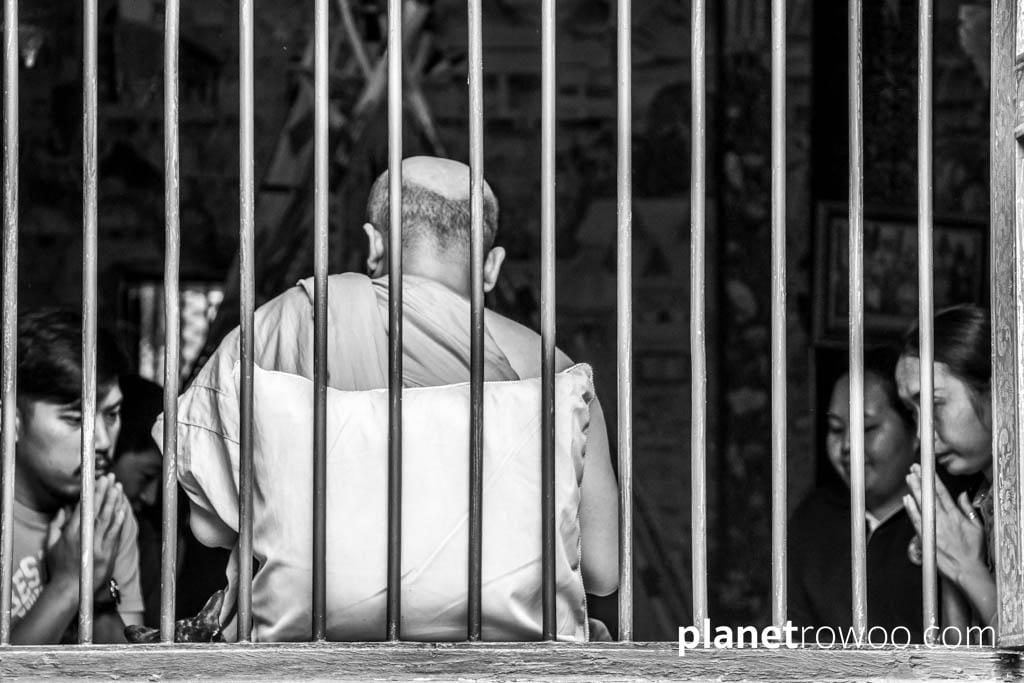 Buddhist monk giving a blessing at Wat Chai Mongkhon