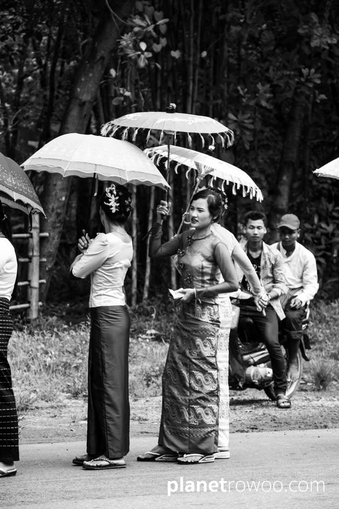 Burmese ladies in traditional dress at a Shinbyu ceremony