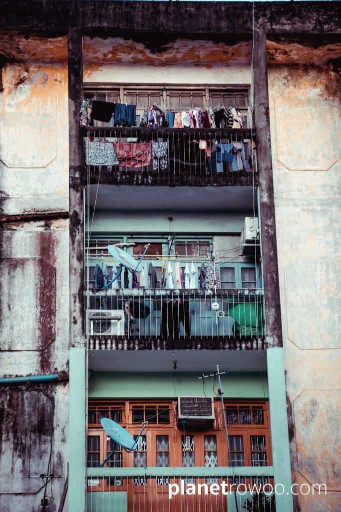 Washing drying on downtown building, Yangon