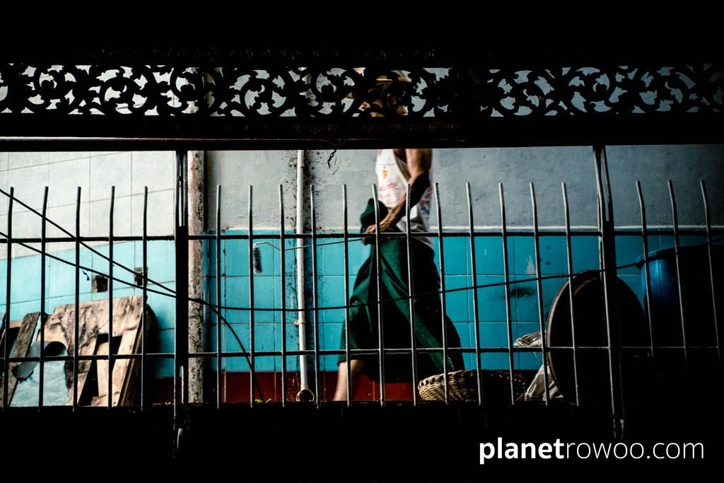 Local worker on walkway at the Sule Pagoda