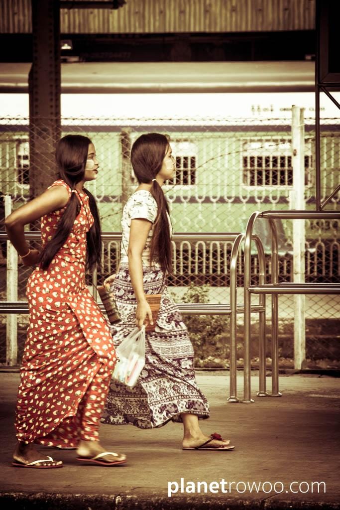 Young women with Thanaka applied to their faces at Yangon Central station