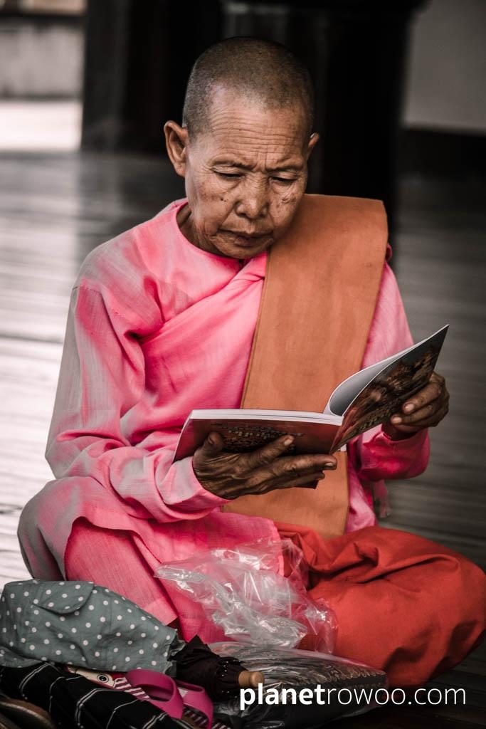 Nun reading at the Shwedagon Pagoda
