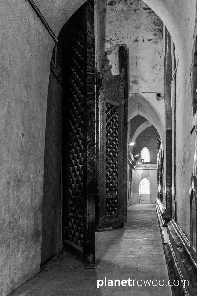 Ananda temple interior corridor with large teak doors