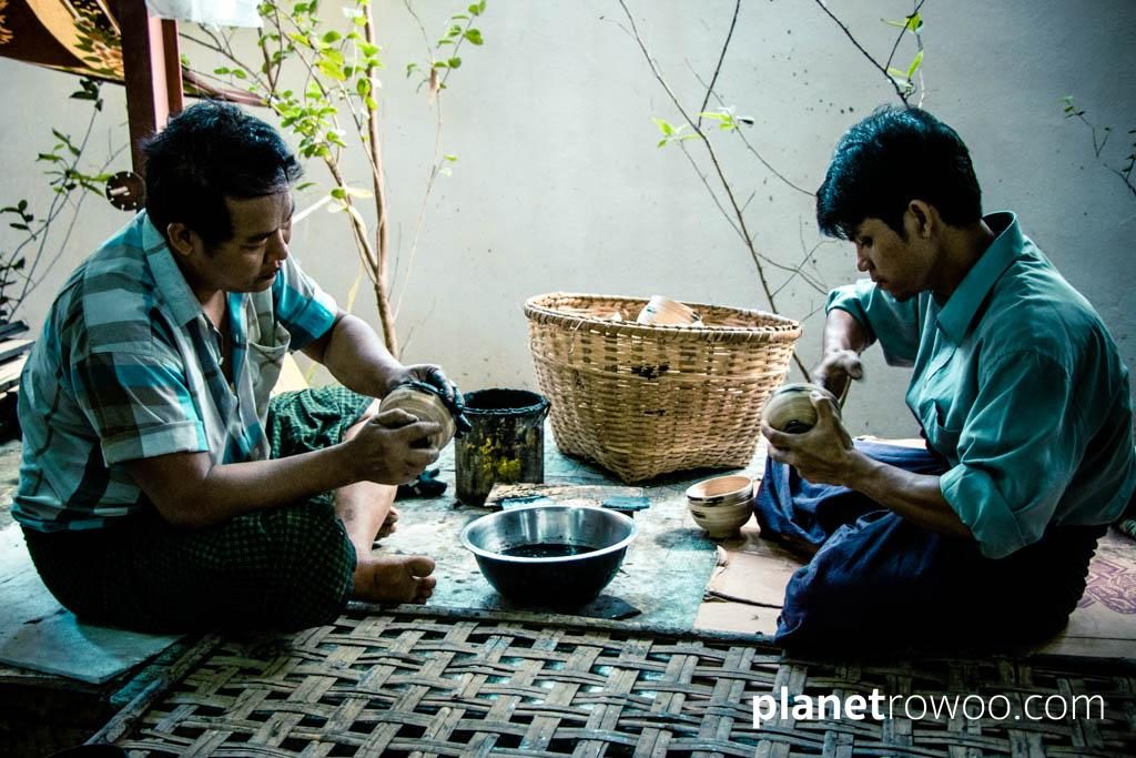 Applying the first of several layers of lacquer to a lacquerware bowl in a Bagan lacquerware workshop