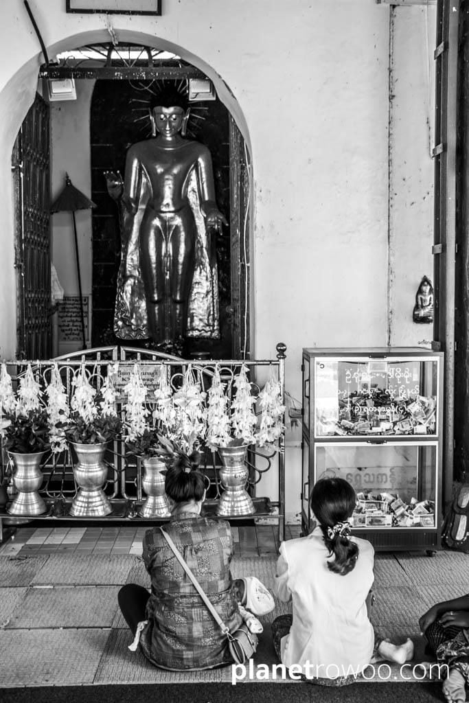 Paying respects to Buddha at the Shwezigon Pagoda