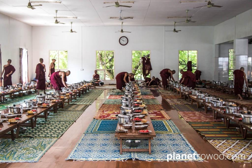 Novice monks prepare the dining hall in Mandalay monastery
