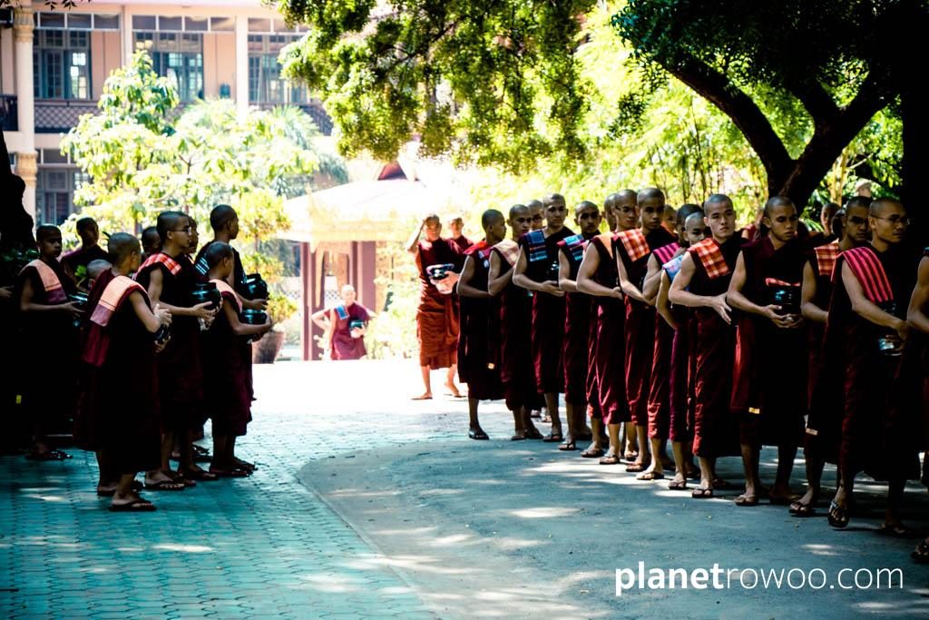 Monks wait in line for lunch at Mandalay monastery