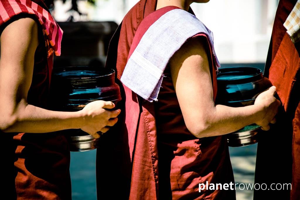 Monks with their alms bowls at Mandalay monastery
