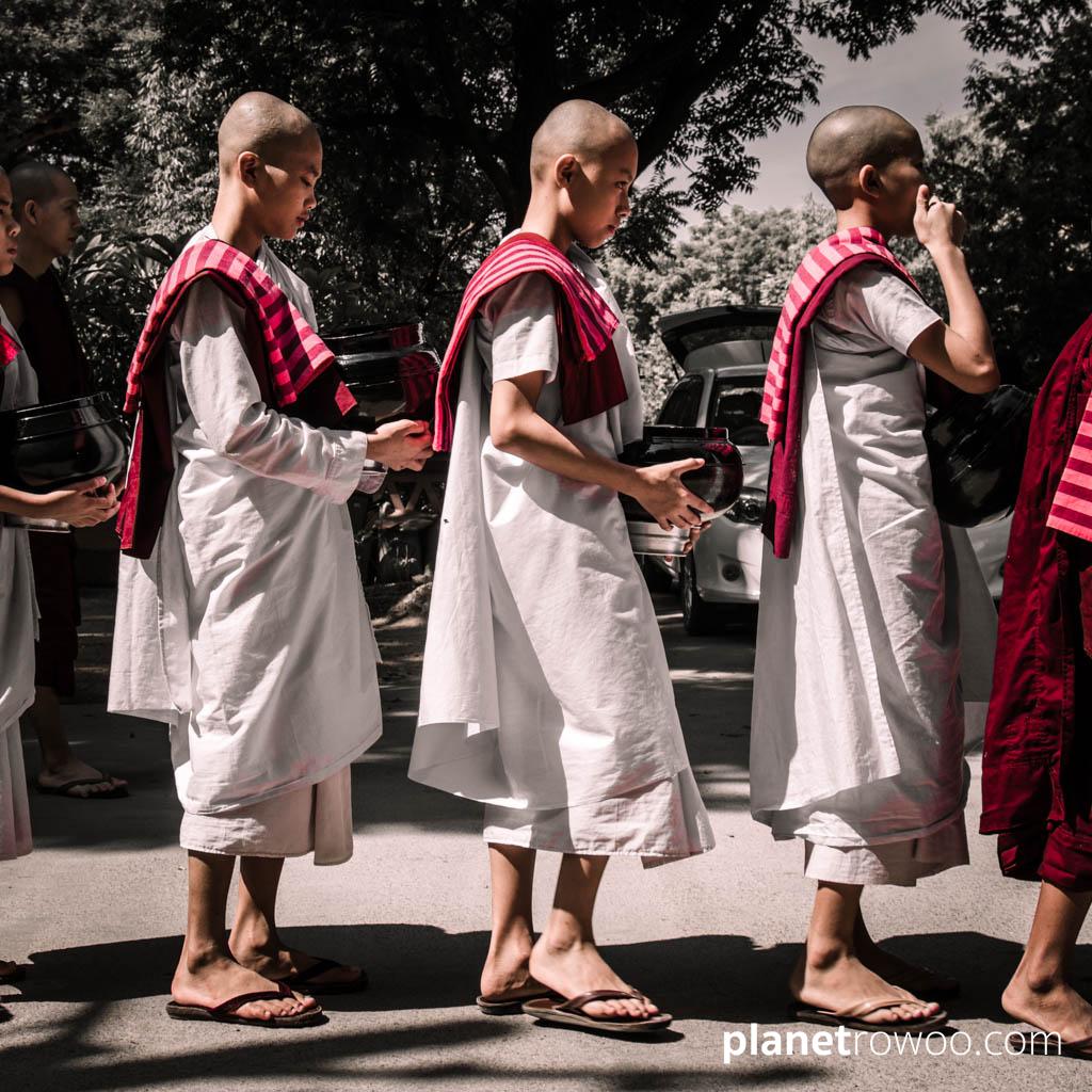 Novice nuns waiting in line for lunch at Mandalay monastery