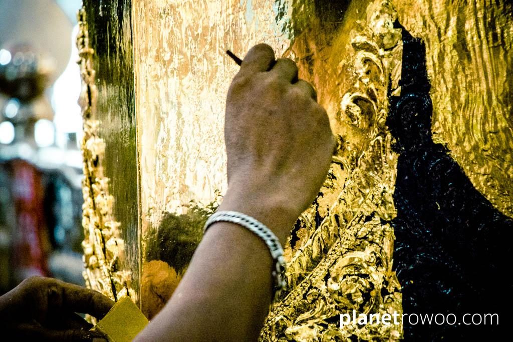 Applying gold leaf at Soon U Ponya Shin Pagoda