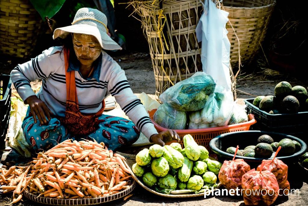 Kalaw market trader amongst her produce