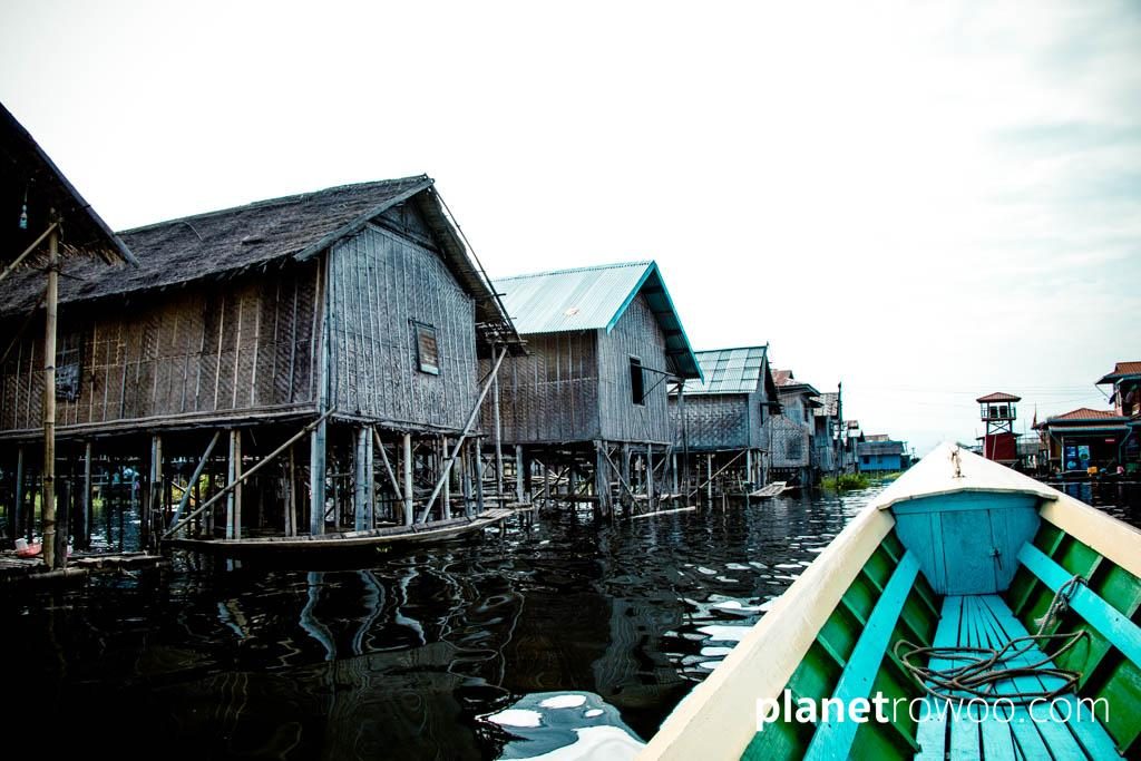Passing village houses of Inle Lake