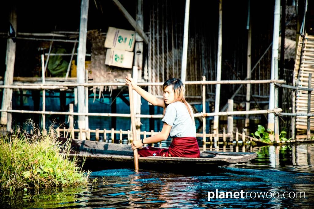 A rowing boat is the only way to travel for this Inle Lake village girl