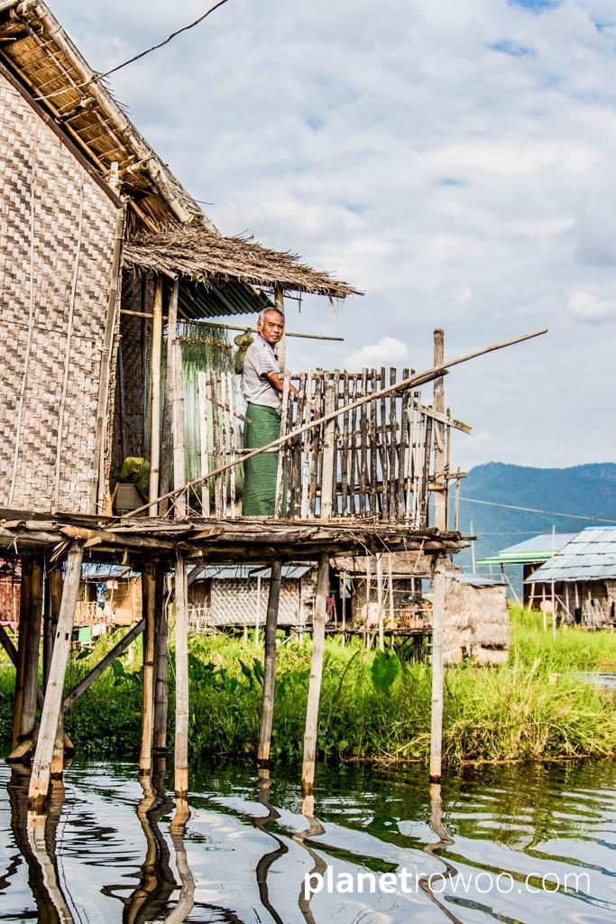 An Inle Lake villager looks on from his 'balcony'