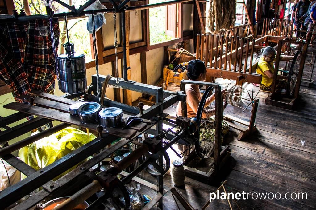 Inpawkhone village women spin lotus thread on their spinning wheels, Inle Lake