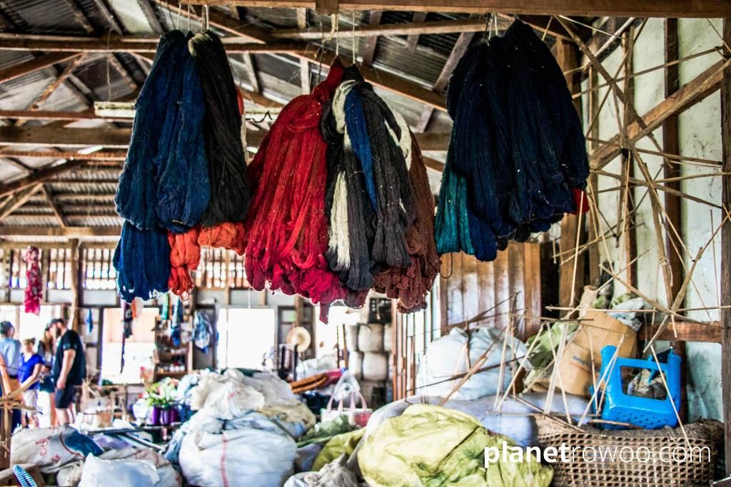 Hand-dyed lotus yarn hanging in the weaving factory, Inpawkhone weaving village