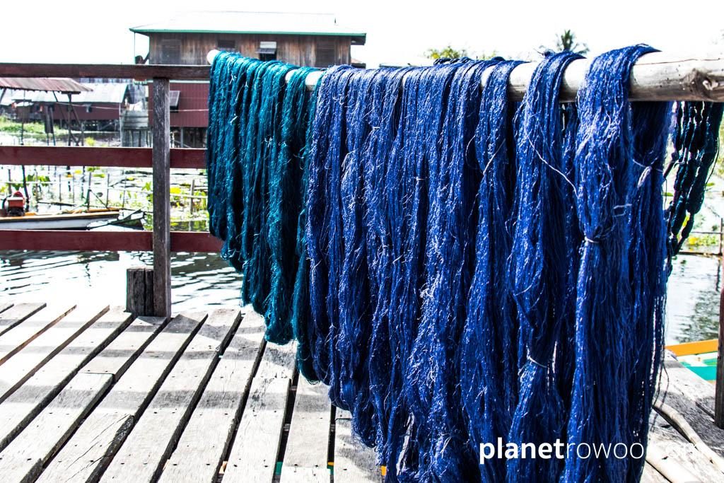 Hand-dyed lotus silk drying on the weaving factory deck, Inpawkhone weaving village