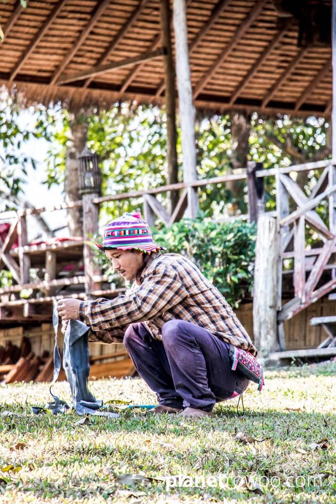 A Lisu maintenance worker in the grounds of Lisu Lodge