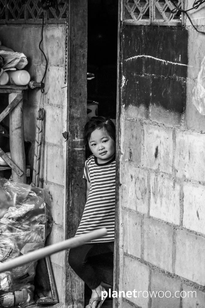 Lisu hill tribe girl at doorway