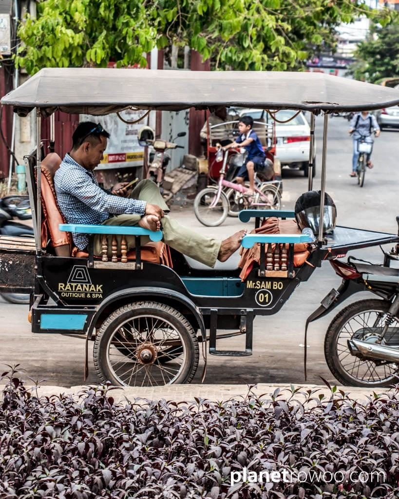 Taking a break in a remork-moto, Siem Reap, Cambodia