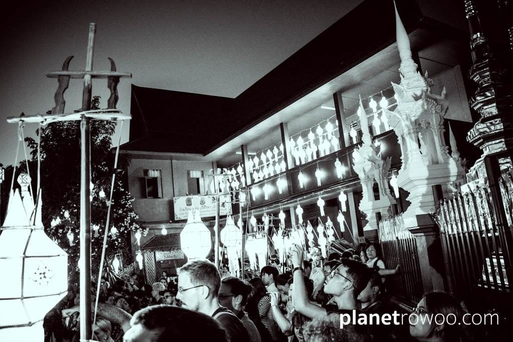 A crowd gathers in anticipation of the Yee Peng ceremony at Wat Phan Tao, Chiang Mai