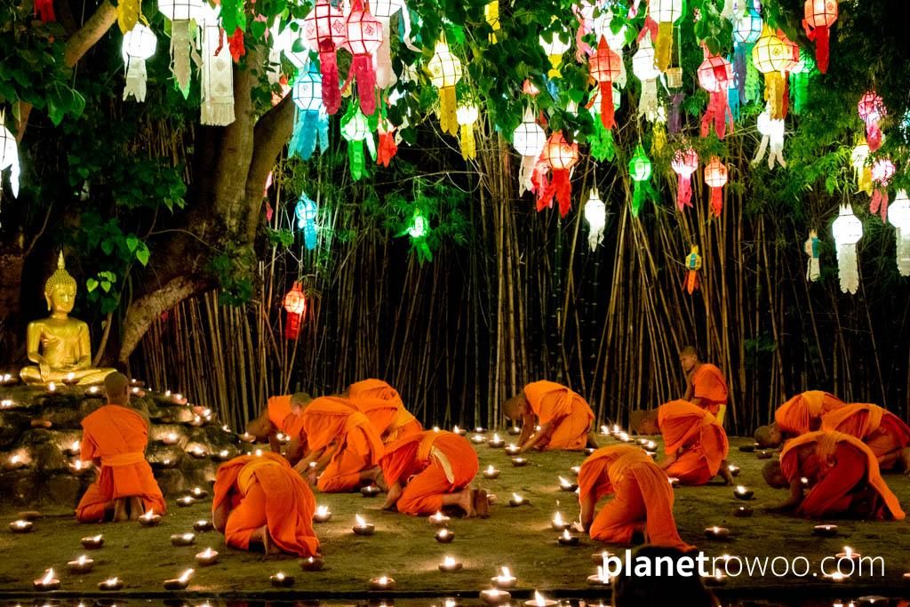 Novice monks pay respects to the golden Buddha image at Wat Phan Tao, Chiang Mai