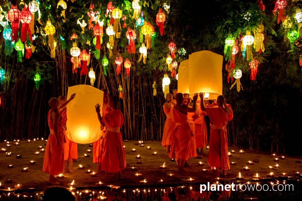 Novice monks release sky lanterns at Wat Phan Tao during the Yee Peng festival in Chiang Mai