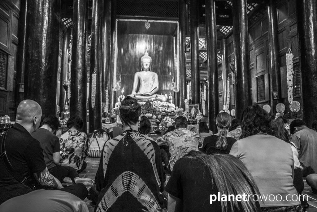 Monks, Buddhists and western visitors gather together for Makha Bucha at Wat Phan Tao, Chiang Mai