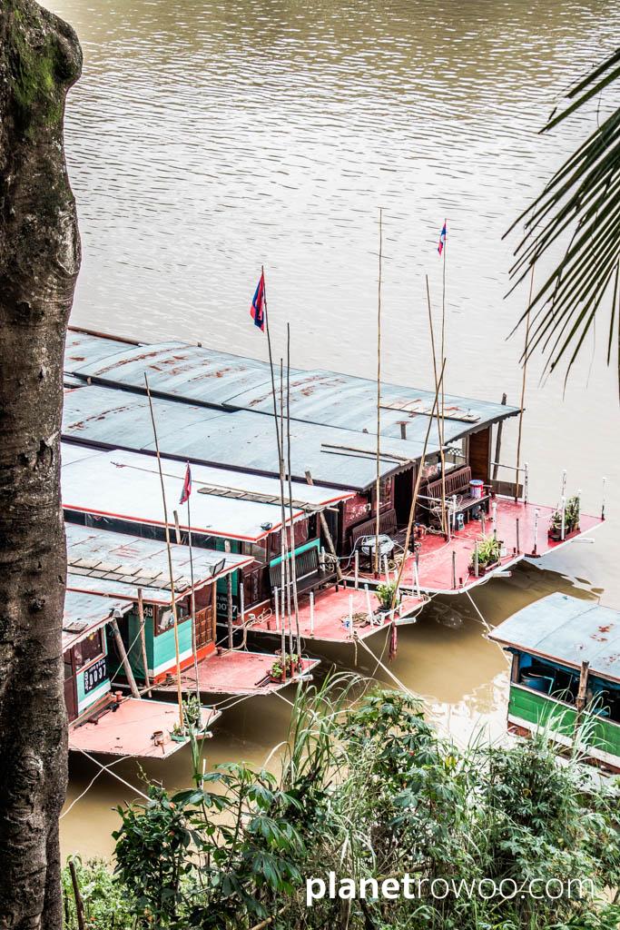 Laos traditional long boats on the Mekong River at Luang Prabang